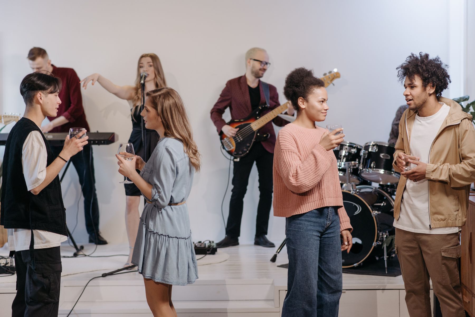 Friends gathering while a band plays